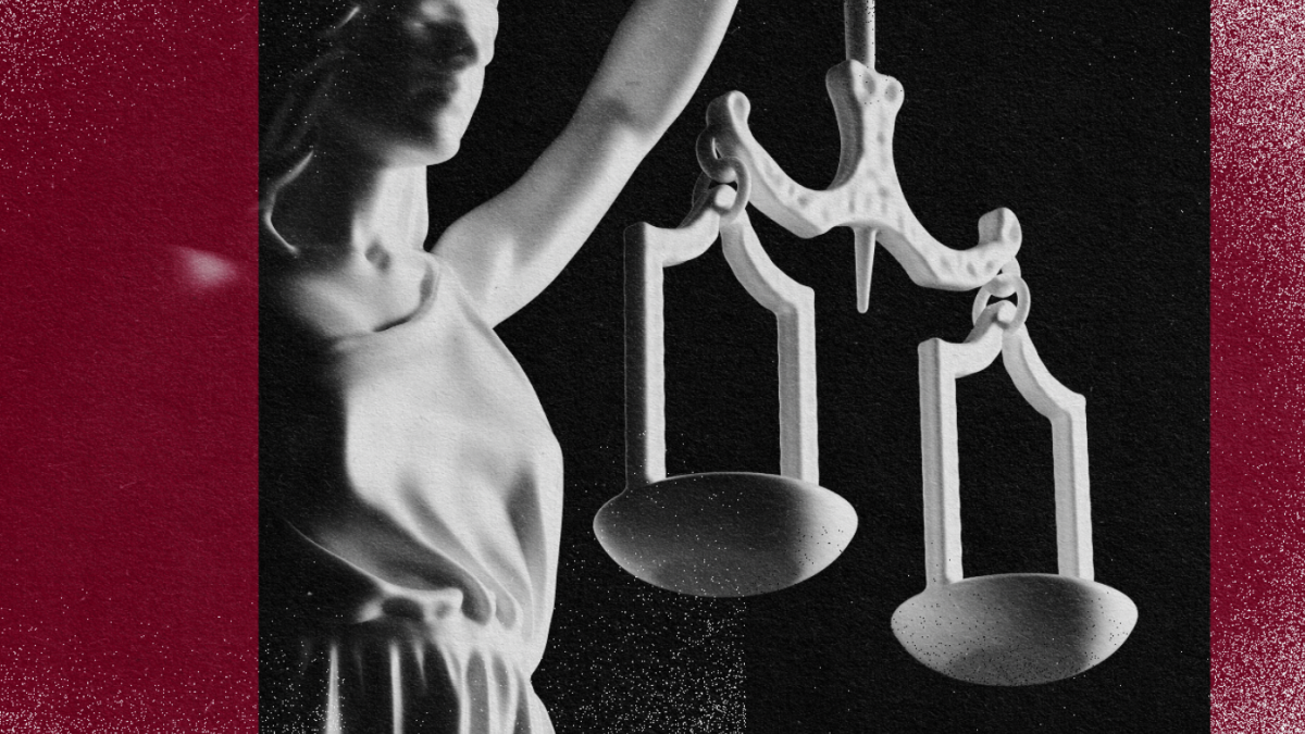 An image of a statue symbolizing human rights, delicately holding scales of justice.