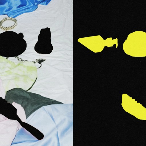 A black and white photo of clothes and a yellow spoon on a bed.