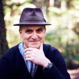 A man wearing a hat and a sweater.