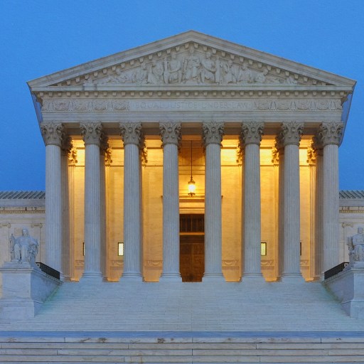 The United States Supreme Court building, a neoclassical structure with tall columns.