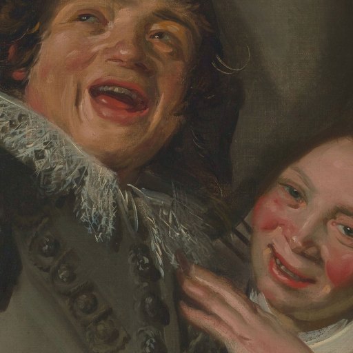A close-up of two people with rosy cheeks, smiling and laughing together, wearing historical clothing and ornate collars.