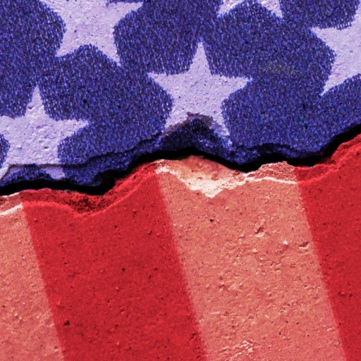 Fragmented image of the U.S. flag with white stars on a blue background and red and beige stripes, resembling weathered paint on a wall.