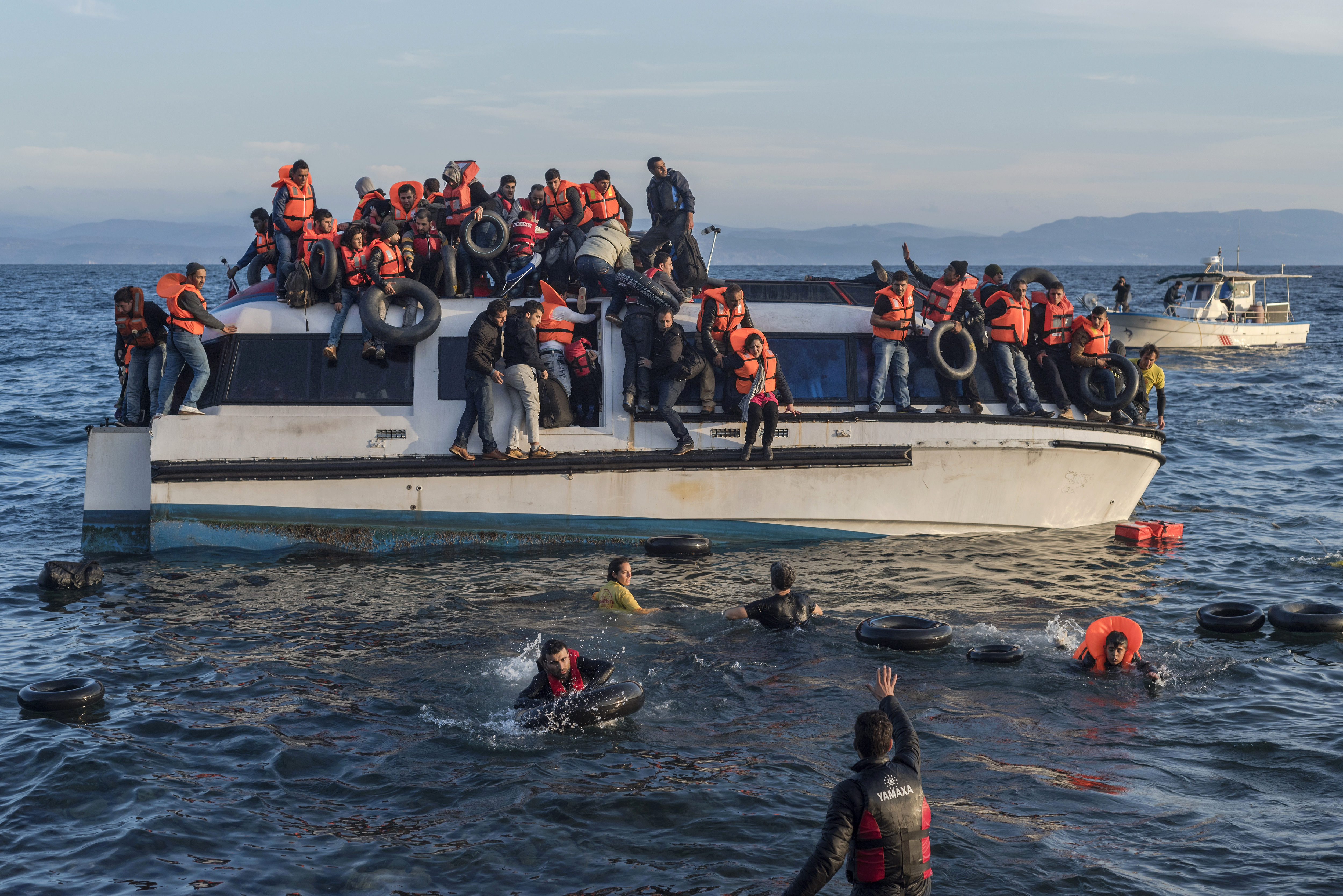 Syrian and Iraqi refugees on a boat.