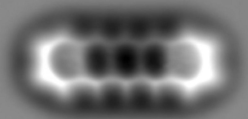 The atomic force microscopy image reveals how small fundamental particles can form a single molecule, showcasing a visible structure of interconnected hexagonal rings.