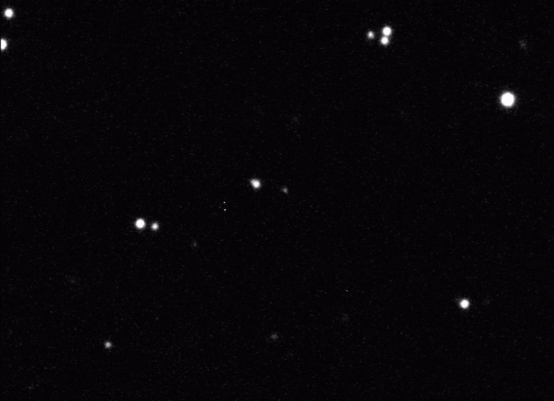 A black and white image of a starry sky captures the serenity of space, with bright stars scattered across the dark backdrop, subtly hinting at the mysterious paths of celestial wonders like asteroid YR4.