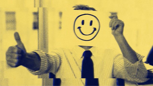 A person in a suit holds a paper with a smiley face over their head, giving the thumbs-up with the other hand—perhaps caught in the people-pleaser trap, masking true feelings for approval.