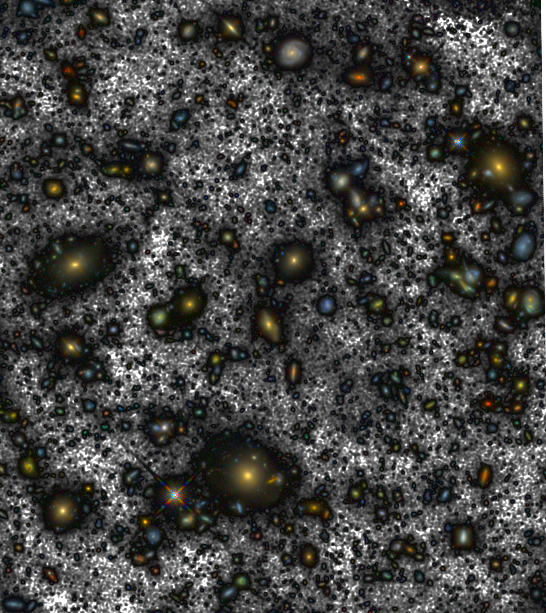 A dense field of galaxies and stars, brighter than astronomers ever imagined, scatters across the sky with varying sizes and colors set against a textured, dark background.