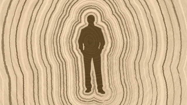 Silhouette of a person standing with hands in pockets, surrounded by concentric oval lines resembling tree rings that symbolize lifespan, in various shades of brown.