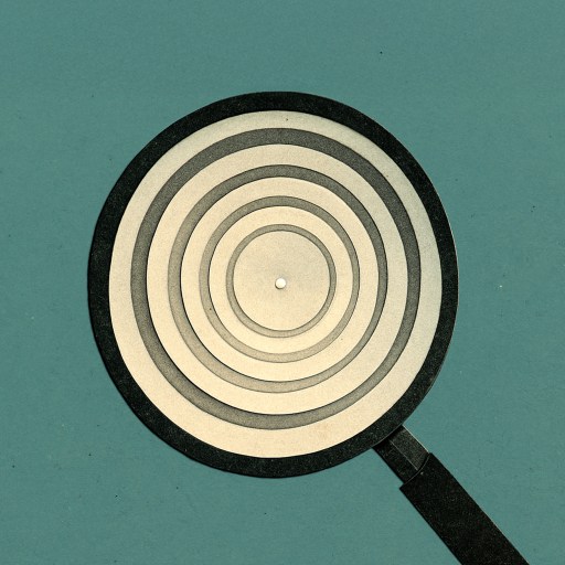 A magnifying glass focusing on concentric circles against a plain teal background.