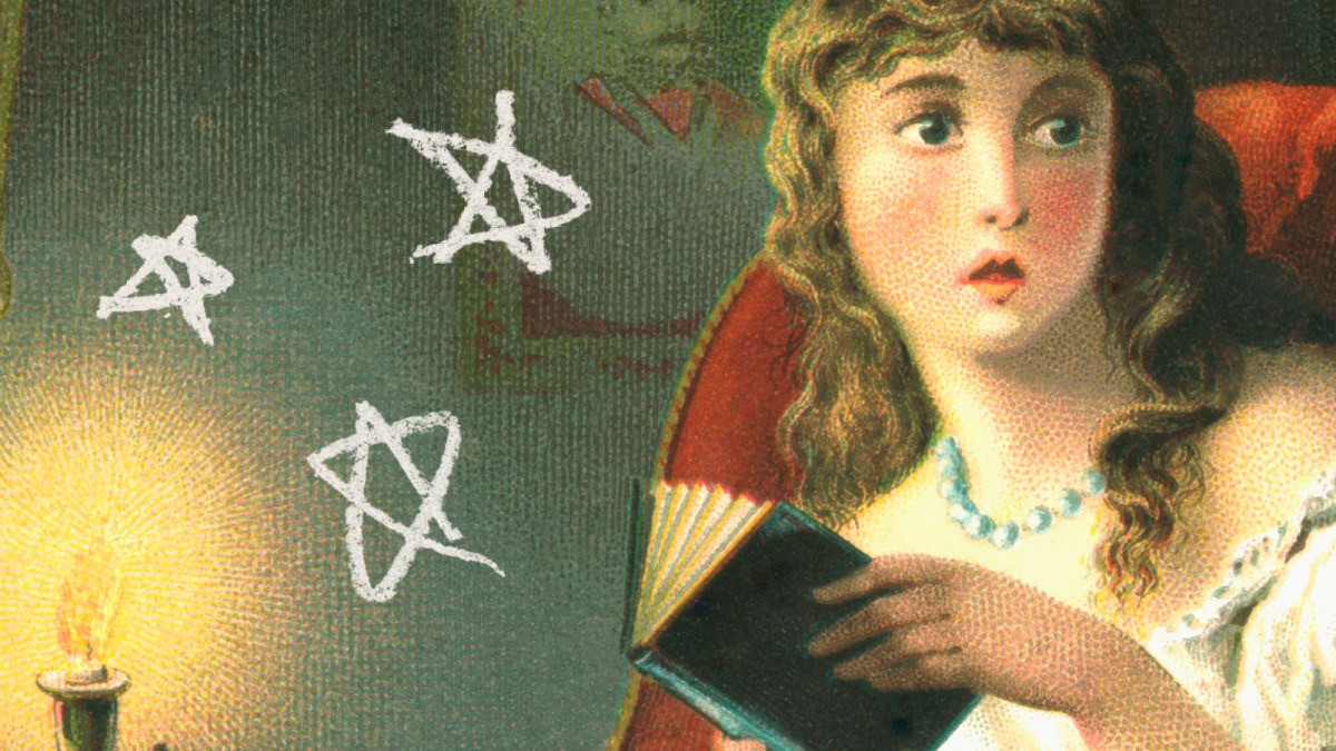 A woman with curly hair sits in a chair holding an open book, looking to the side, surrounded by strange books, drawn white pentagrams, and a lit candle nearby.