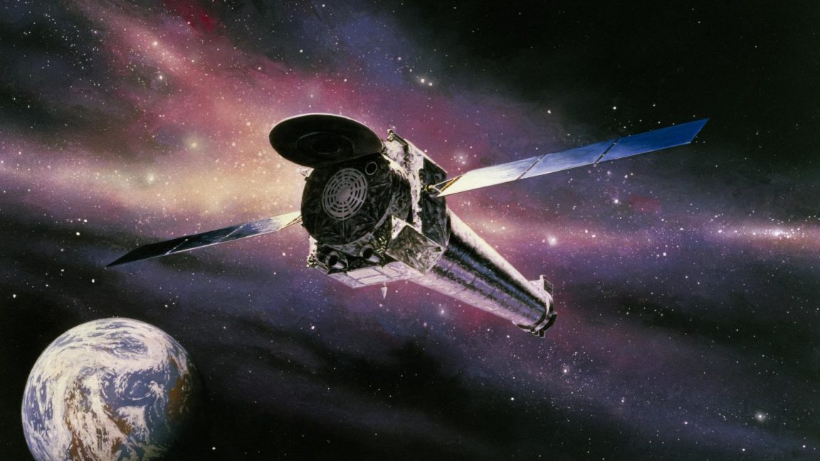 A satellite with large solar panels orbits above Earth against a colorful space background, where the cosmic clouds resemble the Hand of God carved by a dead star.