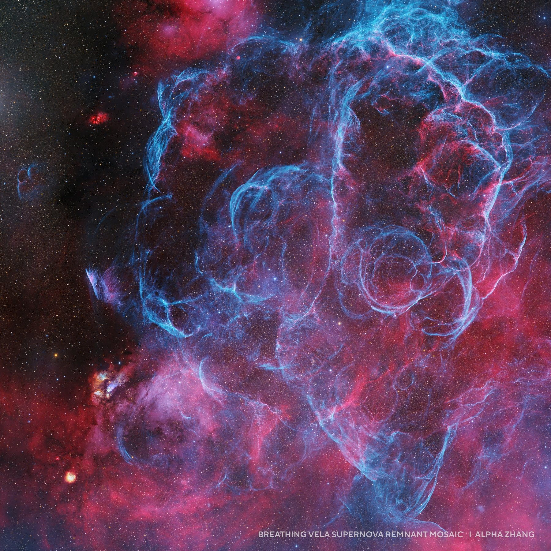 Colorful nebula with bright blue and pink swirling gas clouds in deep space, depicting the Vela supernova remnant mosaic—an inspiring feature among 2025 night sky images.