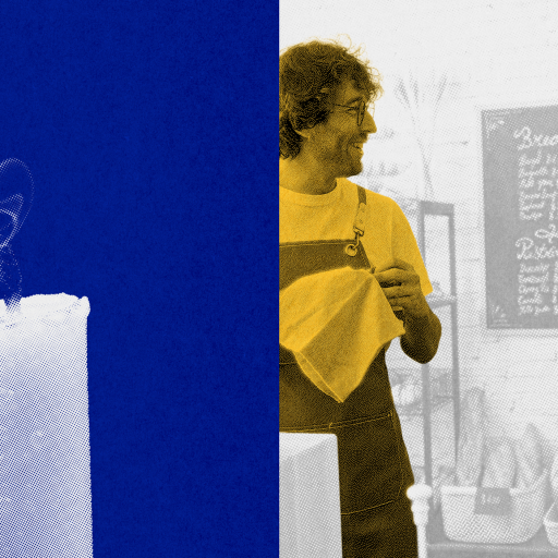 A white candle with smoke rising from its wick is shown on the left; on the right, two men wearing aprons stand talking in front of a café menu.