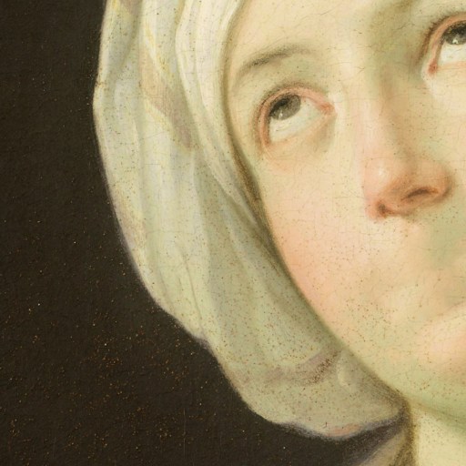 Close-up of a classical painting showing a woman in a white headscarf looking upward with her lips pressed together; background is dark.