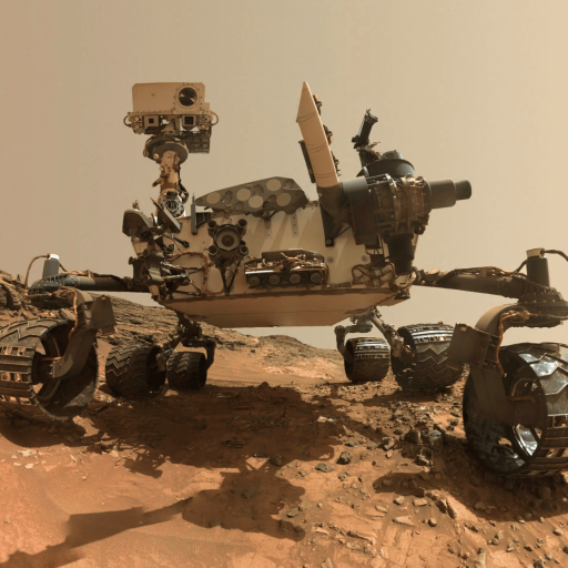 Mars rover on rocky terrain, showing its camera mast, equipment, and six wheels against a dusty, reddish Martian landscape.