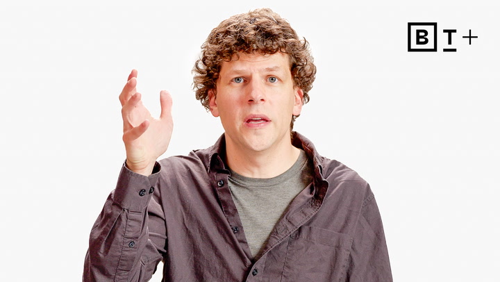 A man with curly hair and a casual shirt gestures with his right hand. The background is white with a "B T +" logo in the top right corner.