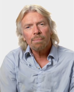 A middle-aged man with long blond hair and a goatee, wearing a light blue collared shirt, poses against a plain white background.