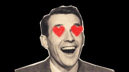 Black and white cutout of a smiling man's face with red heart shapes drawn over his eyes on a black background.