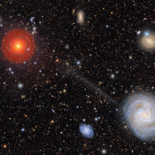 A field of galaxies in deep space, featuring a bright spiral galaxy at the lower right with a stellar stream escaping the galaxy, and a large, bright red star at the upper left.